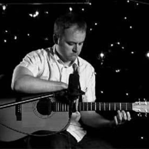 Steven Stark playing guitar