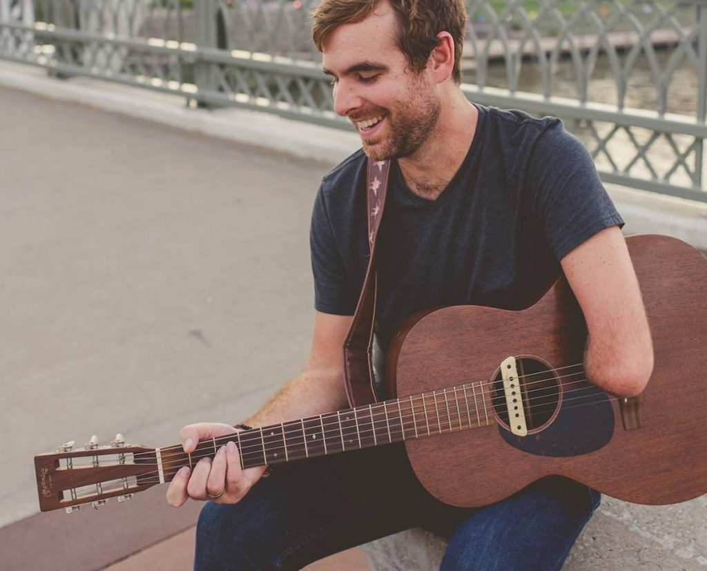 Tony Memmel playing guitar