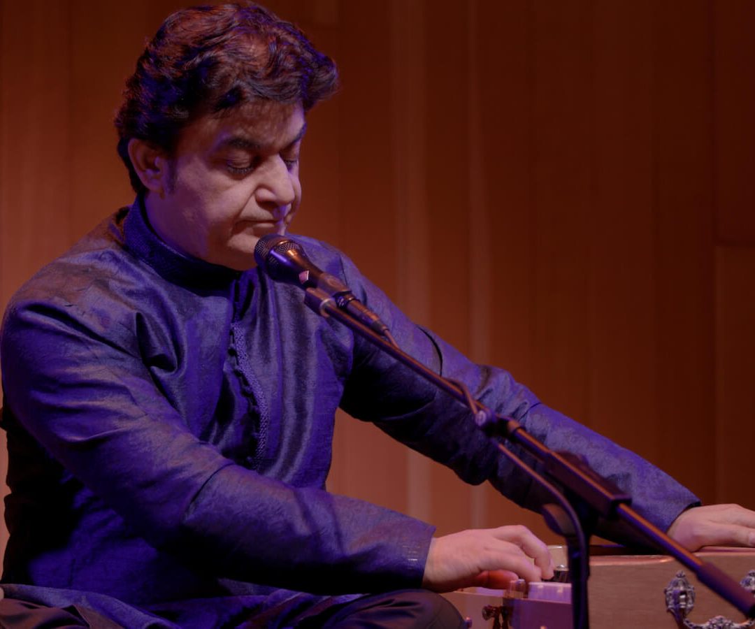 Ahmad playing the harmonium