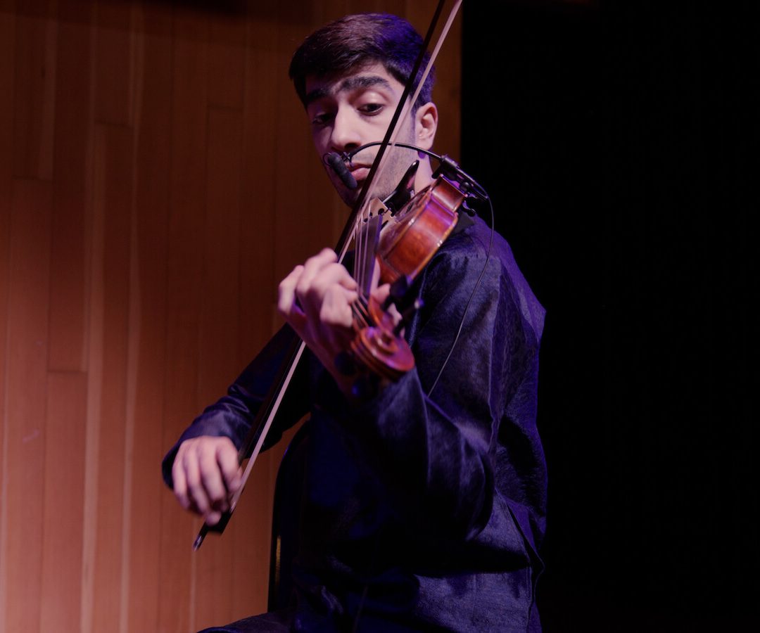 Mehran playing the violin