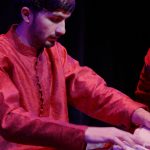 Hamid Zada plays tabla on stage